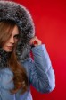 Пуховик в нежно - голубом цвете с капюшоном 